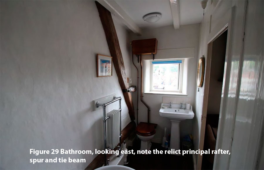 Figure 29 Bathroom, looking east, note the relict principal rafter, spur and tie beam