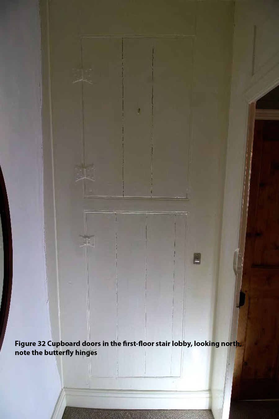 Figure 32 Cupboard doors in the first-floor stair lobby, looking north, note the butterfly hinges