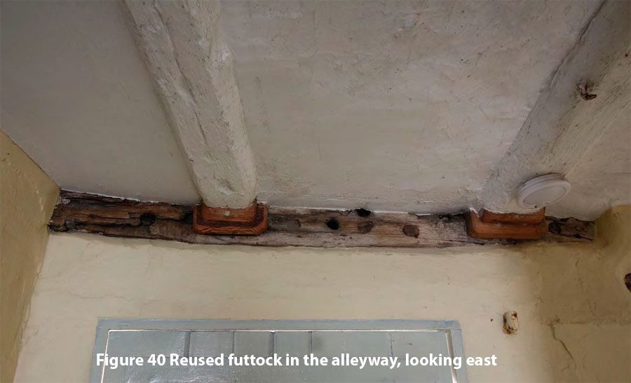 Figure 40 Reused futtock in the alleyway, looking east