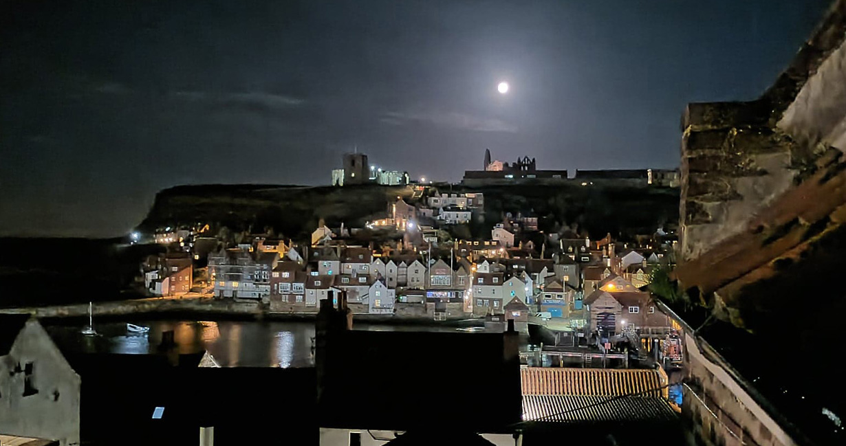 A full moon over Whitby illuminating the east side in a different light