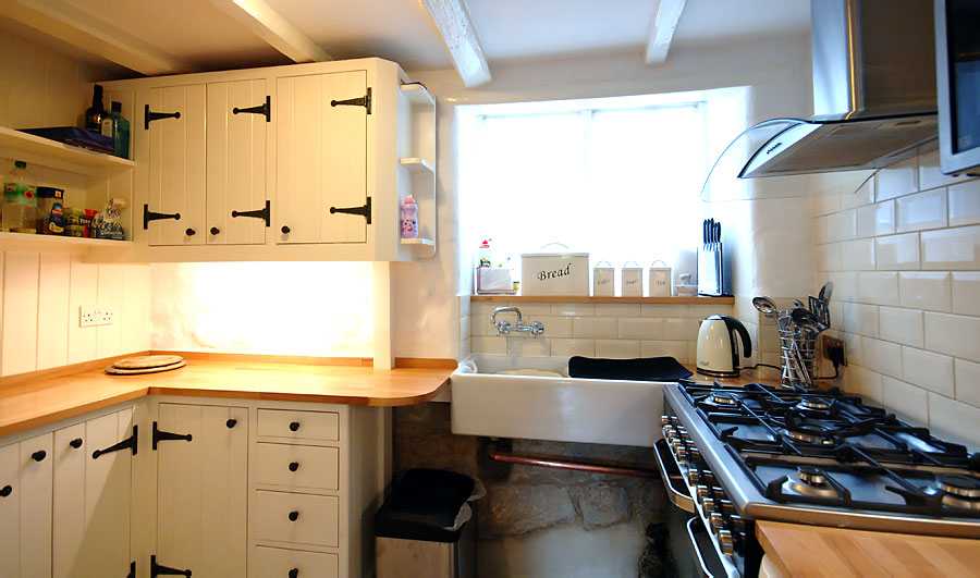 Cottage with window on to Cliff Street, Large range ccoker, Buttlers sink, Drawers and Cupboards